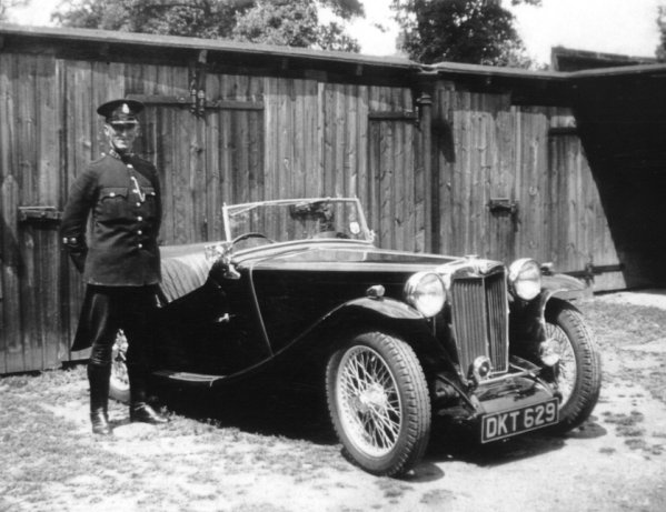 PC (Later Superintendent) Fred Coatsworth
Pc, later Superintendent, Fred Coatsworth with an early patrol MG C car, at No 2 Area Traffic Office, Rochester. (Kent County Constabulary).
Submitted by John Endicott
(Curator Kent Police Museum)

Keywords: Kent MGC Rochester vehicles