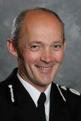 Richard Crompton - Appointed Chief Constable Lincolnshire Police 6 June 2008
Richard Crompton joined the Metropolitan Police in 1976 and three years later, left to pursue full time education. He completed a degree in Politics and Economics and rejoined the police in Devon and Cornwall where he had various uniform postings mainly in the Plymouth, Torbay and Exeter areas. As an Inspector in Torbay and Chief Inspector in Plymouth he developed expertise in partnership working and problem solving policing. 

On promotion to Superintendent he was in charge of force-wide community affairs. During this period he studied part-time at Manchester University and achieved an MA in Organisational Studies.

In 2000 he attended the Strategic Command Course at the National Police College at Bramshill.  During this period he also attended Cambridge University where he obtained a diploma in Applied Criminology.   In April 2001 he took up the post of Assistant Chief Constable with Cumbria Constabulary and was in charge of Force Operations for 3½ years. 

He has national responsibilities within ACPO and is the lead on Vulnerable Adults and Vulnerable and Intimidated Witnesses.

Mr Crompton joined Lincolnshire Police as Deputy Chief Constable on 2 August 2004 where he has held responsibility for Strategic Development, Professional Standards, Legal Services and ICT. 

During 2005 he led a Review Team within the East Midlands region, which has examined proposals for Force restructuring.

In July 2006 he led work across the East Midlands Region designed to increase collaboration across the five forces in order to provide better protective services and increase overall productivity.

Keywords: Crompton CC