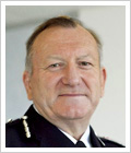 Andrew Trotter OBE, QPM
Andrew Trotter took over as Chief Constable in September 2009 after serving five years as Deputy Chief Constable. Andrew’s police career began with the Metropolitan Police in 1970. He transferred to Kent County Constabulary in 1972 where he gained wide operational experience in both rural and urban areas. He also became a specialist in public order policing.

 

In 1992 Andrew transferred back to the Metropolitan police on promotion to Superintendent and attended the Strategic Command Course in 1995. He was promoted to Commander the same year and became Deputy Assistant Commissioner in 1998. His last post with the Metropolitan Police was as DAC Territorial Operations responsible for Crime Operations, Traffic and Transport, and Public Order.
