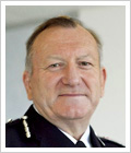 Andrew Trotter OBE, QPM
Andrew Trotter took over as Chief Constable in September 2009 after serving five years as Deputy Chief Constable. Andrew’s police career began with the Metropolitan Police in 1970. He transferred to Kent County Constabulary in 1972 where he gained wide operational experience in both rural and urban areas. He also became a specialist in public order policing.

 

In 1992 Andrew transferred back to the Metropolitan police on promotion to Superintendent and attended the Strategic Command Course in 1995. He was promoted to Commander the same year and became Deputy Assistant Commissioner in 1998. His last post with the Metropolitan Police was as DAC Territorial Operations responsible for Crime Operations, Traffic and Transport, and Public Order.
