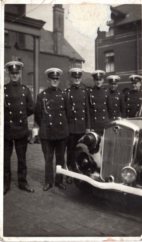 WWII at Police Headquarters, Salford
You can see the "slit covers" over the headlamps to avoid any light being seen from above by the enemy. They've even taken the bulb out of the Wolseley badge on the cars radiator.
Submitted by: Rod Hardisty
