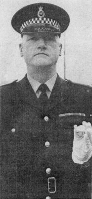 Annual Parade 1975; Leeds
Sergeant Tom Butler's new drill instructor's cane had it's first outing on the Annual Parade. Ordered from a military outfitters in Aldershot the Malacca stick has the West Yorkshire Metropolitan Police cypher embossed on the silver top

Photograph submitted by: Alan Pickles
Keywords: Butler Yorkshire Leeds