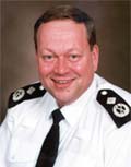 Deputy Commissioner Tim Godwin
He joined the Metropolitan Police Service in November 1999 as Commander (Crime) for South London, and then went on to be South East Territorial Commander and then Commander (Crime) for Territorial Policing. He was promoted to Deputy Assistant Commissioner - Territorial Policing in 2001, then to Assistant Commissioner - Territorial Policing a year later.

During his time in Territorial Policing he introduced a revitalised forensic strategy, instigated and led the Safer Streets initiative, which saw robbery reduce by 30 per cent over a three year period. Through Operation Sapphire he oversaw the introduction of a number of 'Havens' in London where victims of serious sexual assault can receive immediate medical and psychological support.

He leads for ACPO on Mobile Phone crime, which has included the development of the blocking of stolen mobile phones in partnership with industry. He jointly led with Denis O'Connor on the National Reassurance Policing Programme which included the roll out of neighbourhood policing in England and Wales and the Safer Neighbourhoods programme in London. He is currently responsible for Criminal Justice on behalf of ACPO and is Chair of the London Criminal Justice Board (LCJB). The LCJB under his leadership has reduced bureaucracy in relation to case files; introduced further integration with the Crown Prosecution Service; the introduction of virtual courts; and has recently implemented the offender management system.

He was appointed acting MPS Deputy Commissioner in December 2008 and became the permanent appointee in July 2009.
