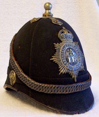 Bristol Constabulary Chained Helmet, circa 1920's
Bristol Constabulary Chained Helmet, circa 1920's, six panel design with blackened balltop, helmet plate, ear rosettes and chinchain
Keywords: Bristol Headwear