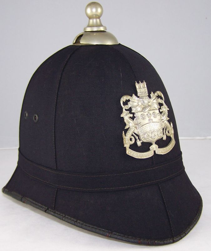 Cambridge Borough Police Helmet
Cambridge Borough Police helmet; smooth cloth; six panel; white metal helmet plate and ball top.
Keywords: Cambridge helmet