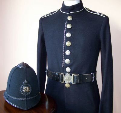 Hampshire Constabulary Uniform, 1923
Hampshire Constabulary Uniform, dated 1923 inside. White piped Norfolk jacket with white metal buttons manufactured by Huggins Son & Co (paper sizes label still remains inside). Helmet is a six panel design with blackened rose and helmet furniture. Please note belt is not correct for this uniform and is included for illustration only.
Keywords: hampshire uniform helmet Headwear
