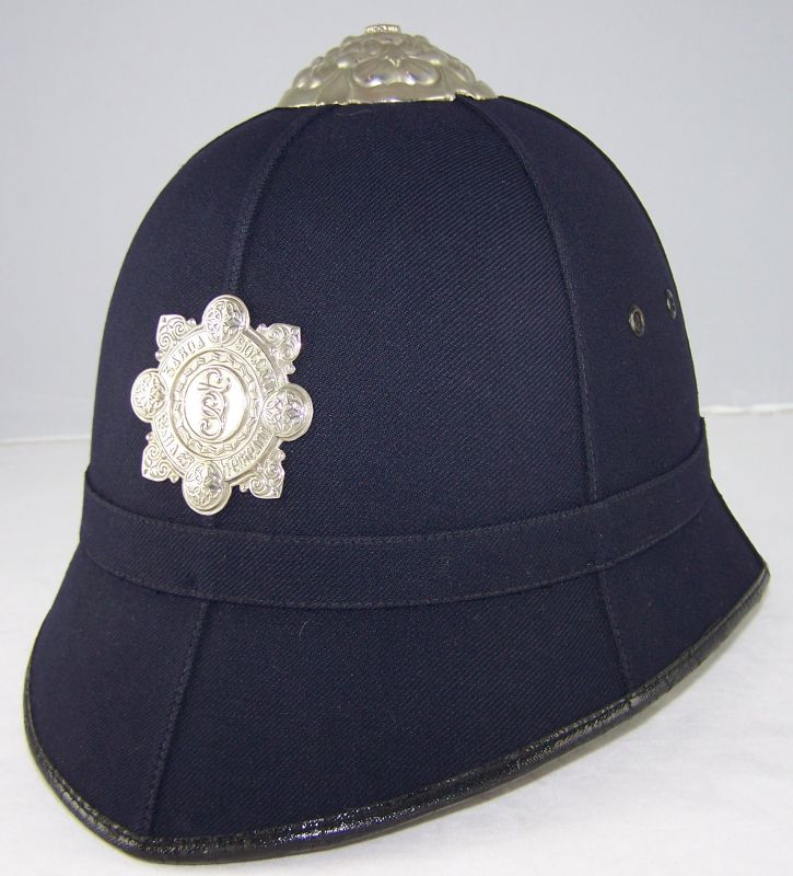 Garda Siochana Helmet
Garda smooth cloth, six panel helmet; late type with small helmet plate.
Keywords: Garda helmet