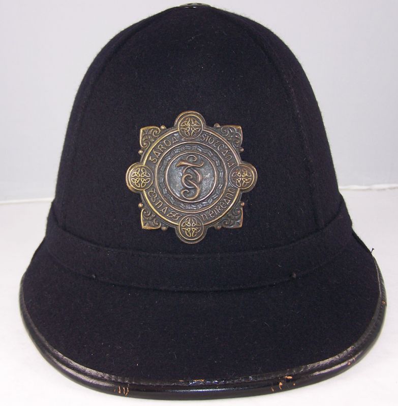 Garda Siochana Night Helmet
Garda night helmet; unusual shape; blackened helmet plate.
Keywords: Garda night helmet