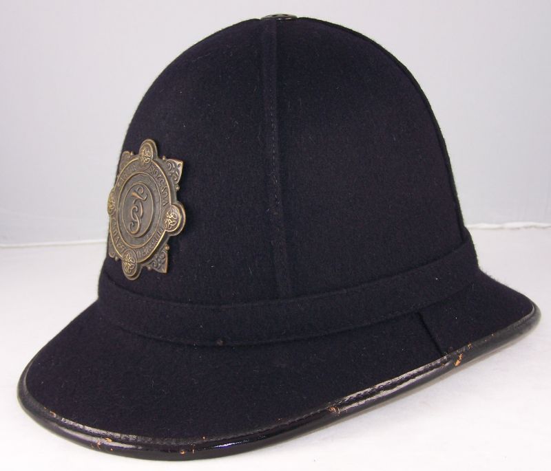 Garda Siochana Night Helmet
Garda night helmet; unusual shape; blackened helmet plate.
Keywords: Garda night helmet