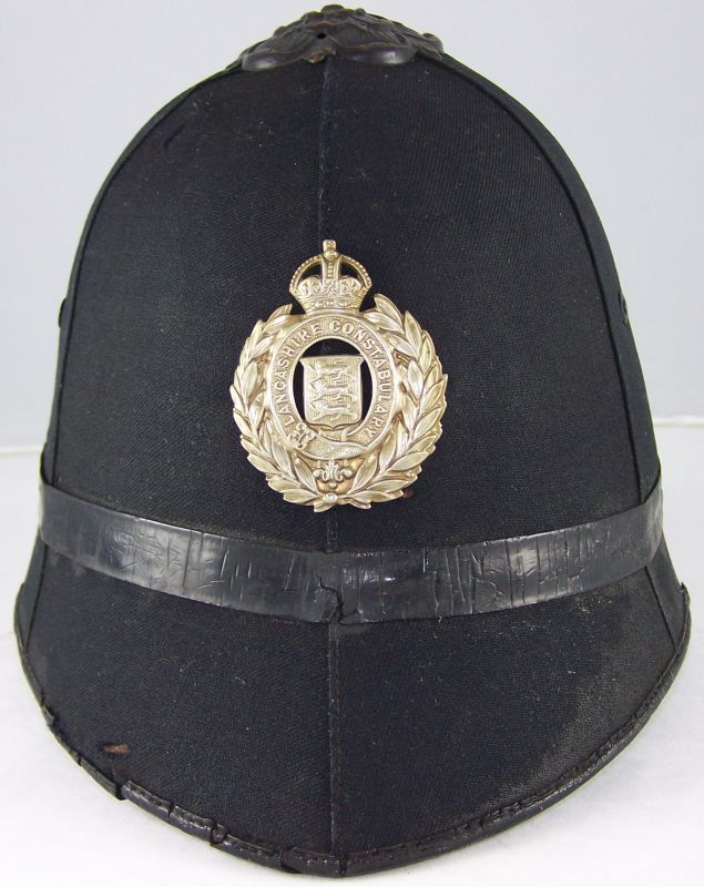 Lancashire Constabulary Helmet
Lancashire Constabulary helmet; blackened unique flat rose with white metal helmet plate.
Keywords: Lancashire helmet