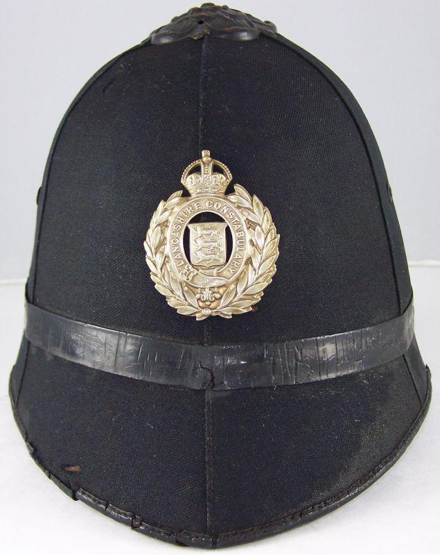 Lancashire Constabulary Helmet
Lancashire Constabulary helmet; blackened unique flat rose with white metal helmet plate.
Keywords: Lancashire helmet