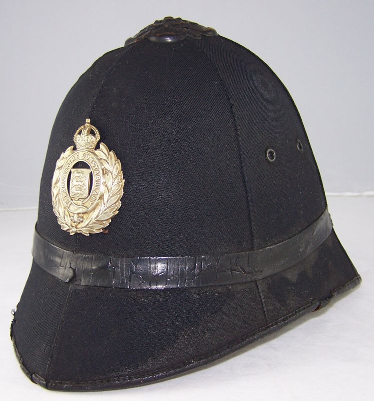 Lancashire Constabulary Helmet
Lancashire Constabulary helmet; blackened unique flat rose with white metal helmet plate.
Keywords: Lancashire helmet