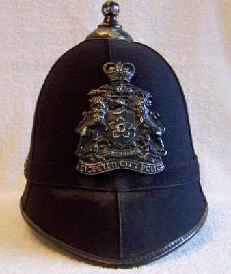Leicester City Night Helmet; 1960's
Leicester City Night Helmet; 1960's, cork helmet with smooth six panel cloth covering, cloth centre band with blackened side roses, ball top and coat of arms helmet plate

Keywords: Leicester helmet headwear