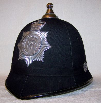 Leicester and Rutland Constabulary Helmet, 1960's
Leicester and Rutland Constabulary Helmet, 1960's, cork body with smooth cloth six panel covering, cloth centre band with chrome side rosettes, balltop and helmet plate
Keywords: leicester rutland helmet headwear