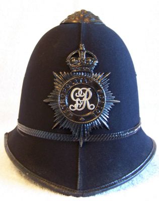 Metropolitan Constables & Sgts Helmet, 1936 - 1938
Metropolitan Constables & Sgts Helmet, 1936 - 1938, two panel design with black rose top and centre band. Black King George V helmet plate
Keywords: metropolitan helmet Headwear