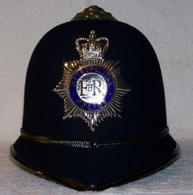 Metropolitan Constables and Sgts Helmet, 1980 - Current
Metropolitan Constables and Sgts Helmet, 1980 - Current. Reinforced design of helmet with blue enamel ring to the bage
Keywords: metropolitan helmet Headwear