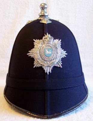 Preston Borough Helmet, 1960's
Preston Borough Helmet, 1960's, six panel design with cloth centre band, chrome balltop and cross base and small chrome helmet plate with enamelled centre
Keywords: preston helmet Headwear