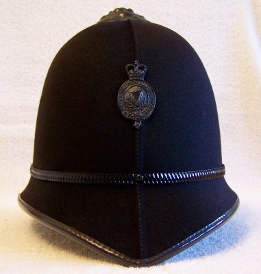 RUC Helmet, 1960's
RUC Helmet, 1960's, two piece cork construction, blackened helmet furniture, worn in Belfast
Keywords: RUC helmet headwear