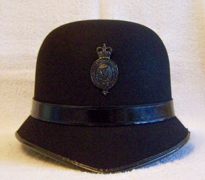RUC Night Bowler, 1960's
RUC Night Bowler, 1960's, one piece fibre construction with black leather centre band, worn at nights in Belfast and Londonderry
Keywords: RUC bowler helmet headwear