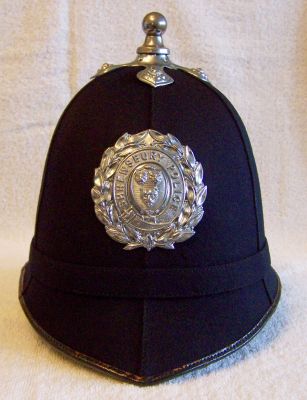 Shrewsbury Helmet, circa 1947
Shrewsbury Helmet, circa 1947, six panel design with cloth centre band, chrome ball top and cross base and helmet plate
Keywords: shrewsbury helmet Headwear