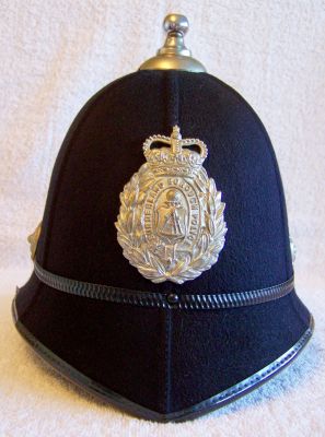 Sunderland Borough Helmet, 1960's
Sunderland Borough Helmet, 1960's, six panel design with black metal centre band with white metal ball top and base, ear rosettes and helmet plate NB Fittings do not seem to be chromed
Keywords: sunderland helmet Headwear