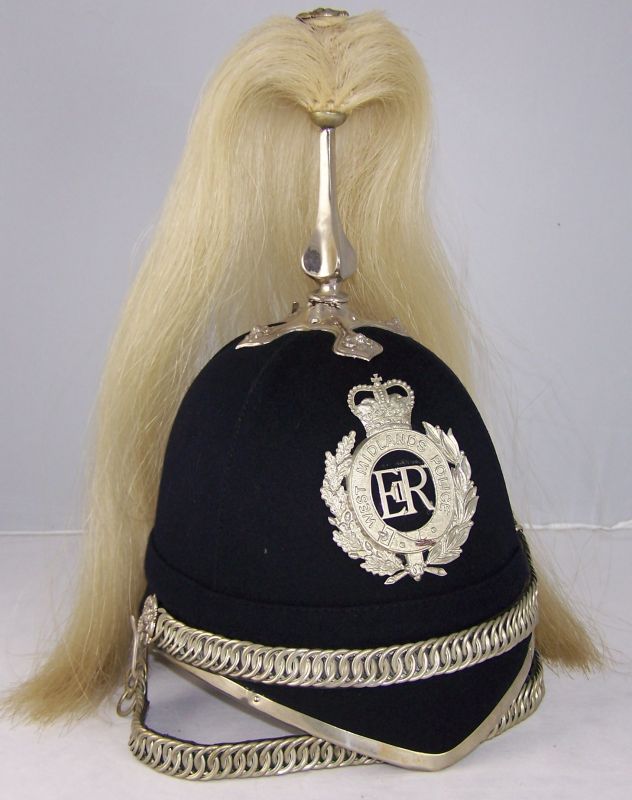 West Midlands Mounted Section Helmet
West Midlands Police Mounted Section helmet; four panel; unusually all white metal fittings (not chromed); two chinchains, one worn across the front of the helmet with the other below the chin.
Keywords: west midlands mounted helmet