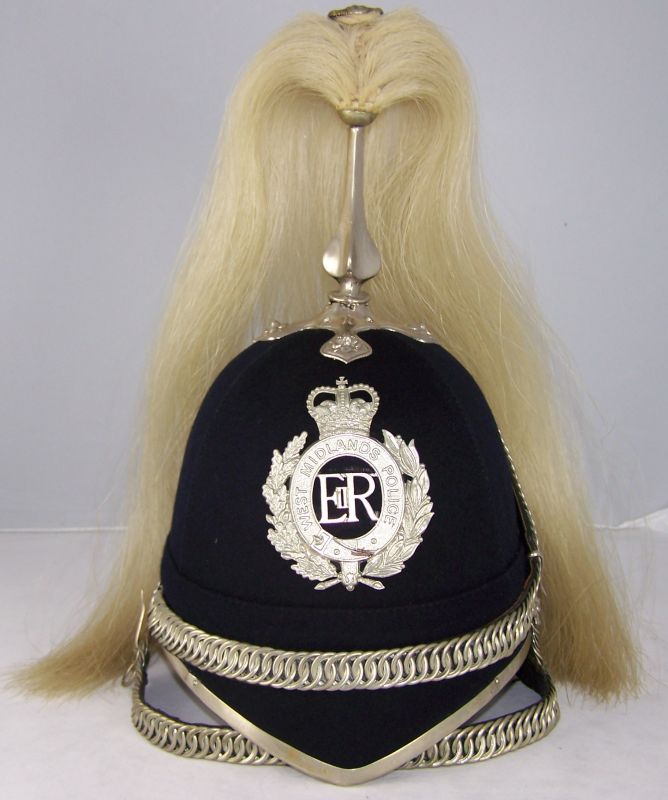 West Midlands Police Mounted Section Helmet
West Midlands Police Mounted Section helmet; four panel; unusually all white metal fittings (not chromed); two chinchains, one worn across the front of the helmet with the other below the chin.
Keywords: west midlands mounted helmet