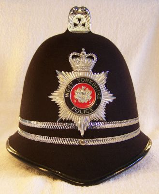 West Yorkshire Police, Inspectors Helmet 1980's
West Yorkshire Police, Inspectors Helmet 1980's, reinforced design with two thin chrome bands to denote rank, 'West Yorkshire Police' spelt in gold lettering
Keywords: west yorkshire helmet headwear