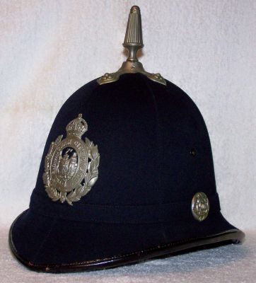 Birmingham City Helmet, 1930's
Birmingham City Helmet, pre 1936, six panel design with cloth centre band, white metal fluted ornate spike and cross base, ear rosettes and helmet plate. White stencilling to inside 'BP C295 34'
Keywords: birmingham helmet Headwear