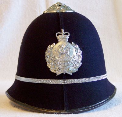 Glamorgan Constabulary Helmet, approx 1963 - 1969
Glamorgan Constabulary Helmet, approx 1963 - 1969, two piece design with chrome rose top, centre band and helmet plate
Keywords: glamorgan helmet Headwear