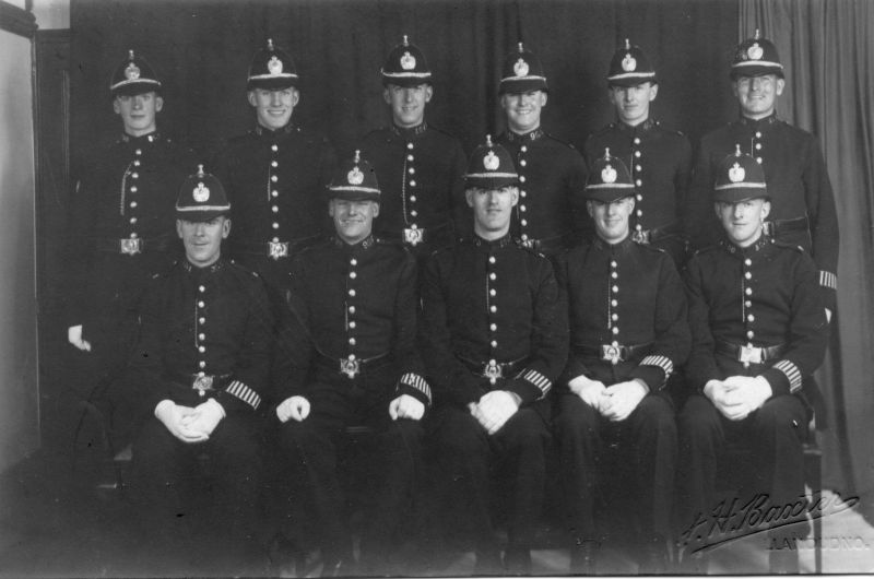 Caernarvonshire Constabulary, GROUP
Formal studio group by Baxters of Llandudno.
Back Row: pc 86c; 68c; 104c; 96c; 45c; 55c.
Front Row: pc 31c; 99c; 102c; 102c; 50c.
