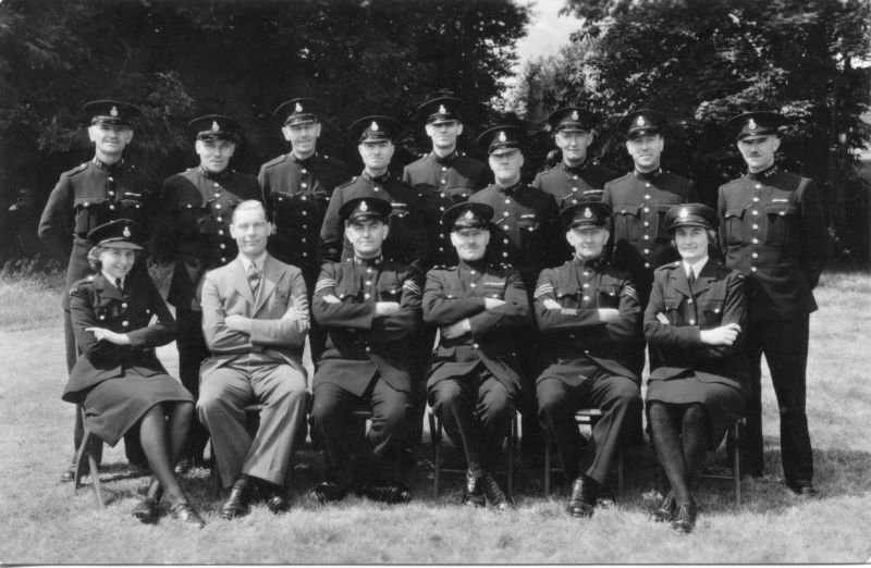 EAST SUSSEX CONSTABULARY, PHOTO DATED 17-JUNE-1945
Photographer: H CONNOLD, High Street, East Grinstead.
Standing: PC 95; WR 459; PC 56; PC 101; WR 388; WR 432
Sitting: WPC; P/CLOTHES OFFICER; SGT. 58; INSPECTOR; SGT. 28; WPC
WPC's are wearing shoulder titles with 'WAPC' on them.

