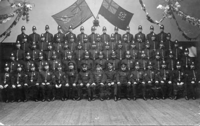 GLASGOW CITY POLICE
Man in 2nd row, 5 from right has a pinhole in his helmet.
May be "Joey Deritt"

