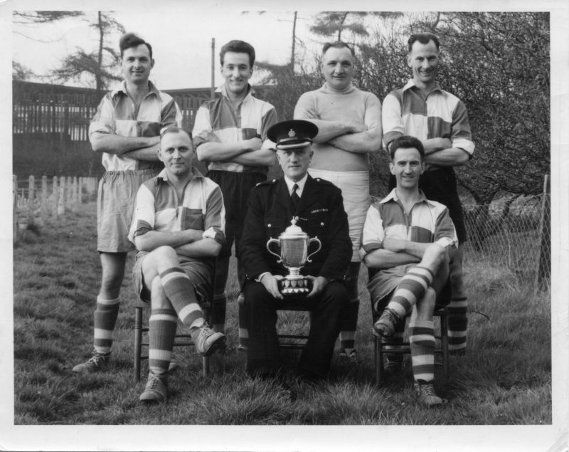 HAMPSHIRE CONSTABULARY, EASTLEIGH
The photo states that it is Supt. Broomfield with some of the soccer team.
It also states that it was taken during the war years.

