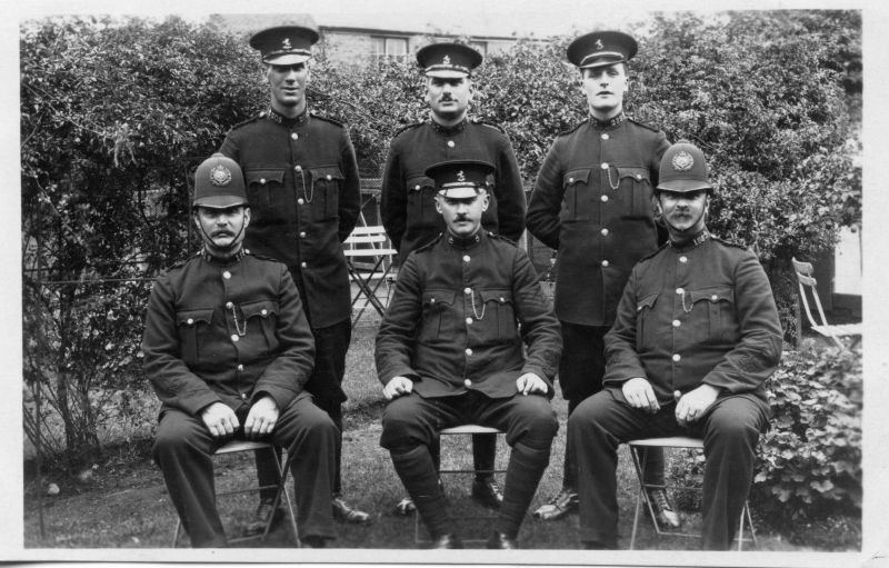 KENT COUNTY CONSTABULARY RAINHAM
Group photo of the 'Rainham Section'.
The PC's are (back row) 203/40/232, (front row) 15/188
The Sgt in the centre is Charles SPEED, and was living at 61 Essex Street, Whitstable

I can confirm the following: Constable 260 Charles Reginald Speed was born in 1890 at Whitstable Kent joined the force being posted to Tonbridge in February 1912 [following training], served also at Edenbridge (still pat of Tonbridge division). After passing the sergeants exam in December 1917 eventually transferred to Sittingbourne on promotion in 1922. Pensioned 1937. Residence prior to joining 61 Essex Street Whitstable, grocers asst. before joining.

From: Pam Mills (6/1/2020)
