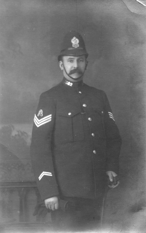 LANCASHIRE CONSTABULARY Sgt. 1382
Wearing a merit badge.
The photographer is W.Hallworth of Queens Hall Studio, Church.
