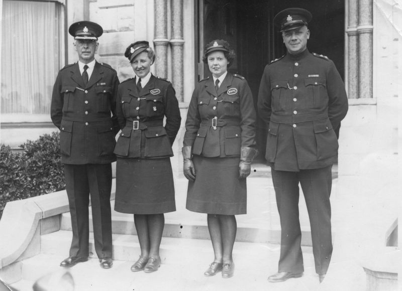 LANCASHIRE CONSTABULARY WITH LADIES OF THE W.A.P.C.
Photo shows two (Supt. and Insp.) together with two ladies of the Women's Auxiliary Police Corps.
I believe this to be shortly after the end of WW2 as both officers are wearing WW2 medals.
Photo by: R W Lord, 22 Collingwood Avenue, St. Annes-On-Sea.
