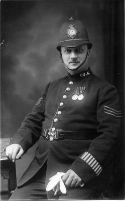 METROPOLITAN POLICE, K DIVISION, SGT. K60
WEARING KING EDWARD 7th AND KING GEORGE 5th CORONATION MEDALS.
PHOTOGRAPHER, JOHN MARTIN of 59 EAST INDIA DOCK ROAD.
Keywords: Met officer