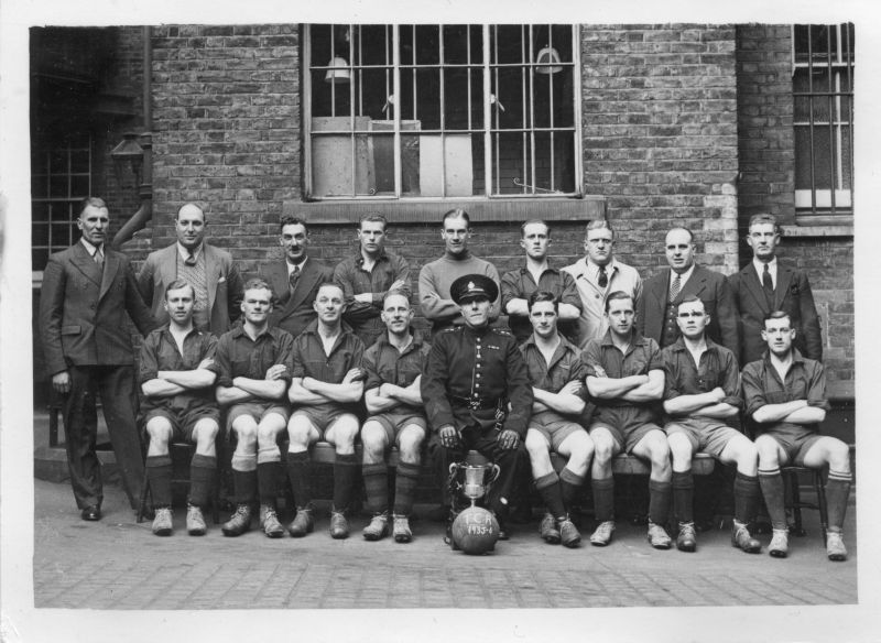 METROPOLITAN POLICE, 'C' DIVISION SOCCER TEAM
Photo taken Easter 1936 at Tottenham Court Road.
names on the back as follows:
Back Row: Munn; Sgt. Bacon; Castell; Wilson; Shave; Wood; Sgt. Powell; Chigwell; Cross.
Front Row: Enraker; Adams; Buckingham;Crichwer; S.D.I. Smith; Duncan; See below; Dabour

The missing person is stated to be PC 318C and I believe his name to be Peek.
