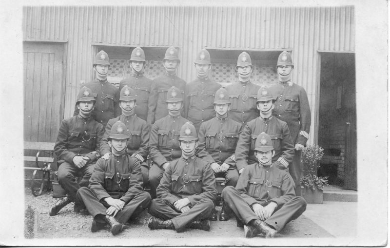 METROPOLITAN POLICE 'H' DIVISION (DATED 08-AUGUST-1914)
Postcard mailed from Chatham on 08/08/1914.
Message talks of being armed with automatic pistols.
Back Row (L - R) PC 54H; 531H; 75H; 512H; 437H; 464H
Middle Row (L - R) PC 207H; 84H; 419H; 282H; 559H
Front Row (L - R) PC 554H; 387H; 399H
