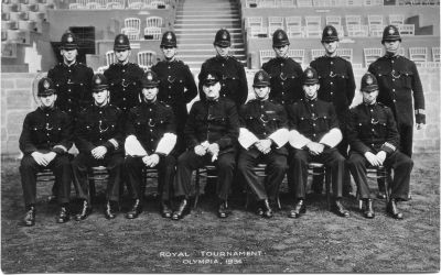METROPOLITAN POLICE, ROYAL TOURNAMENT 1934
I believe this was a display team that appeared at the tournament
PC 422F Price Edgar, is front row left hand end.

 Back Row: PC 434F/130F/332F/188F/110F/174F/98F

Front Row: PC 422F/282\f/247F/INSP./PC 348F/223F/432F
