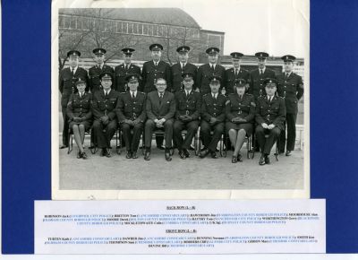 CHESHIRE CONSTABULARY (AND OTHERS) TRAINING GROUP(NAMED)
Back row (L - R)
Robinson Jack(Liverpool), Britton Tom(Lancashire), Hawthorn Jim(Warrington), Moorhouse Alan(Oldham), Moore Derek(Bolton), Rattry Tom(Manchester), Worthington Gerry(Blackpool), Micklethwaite Colin(Cumbria), Sgt.(Burnley).
Front Row (L - R)
Turten Kath(Lancashire), Dawber Jim(Lancashire), Dunning Norman(Warrington), Smith Ken(Oldham), Thompson Sam(Cheshire), Borders Cliff(Salford), Gibson Mary(Cheshire), Devine Bill(Cheshire).
