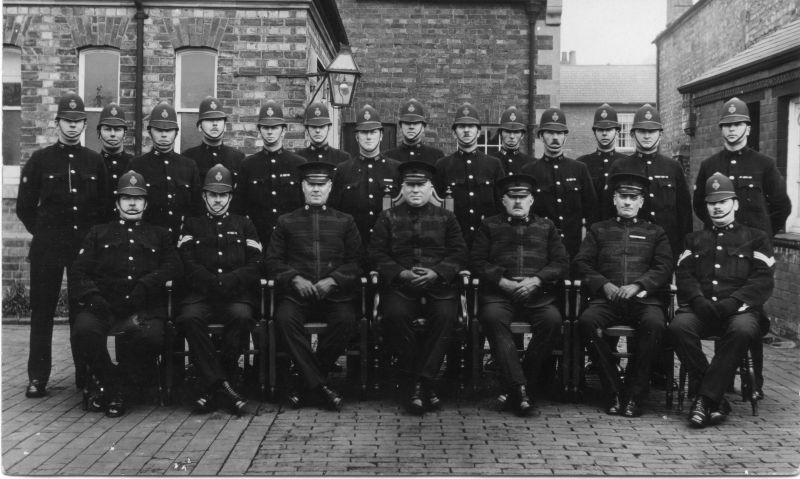 NORTHAMPTONSHIRE CONSTABULARY
Back Row L - R):
PC's 63; 17; 120; 6; 65; 125; 109; 134; 77; 132; 96; 52; 56; 4
Front Row (L - R):
PC 45; Sgt 18; Officer; Officer; Officer; Officer; Sgt 3

Photo by: R Kingston, Towcester.
