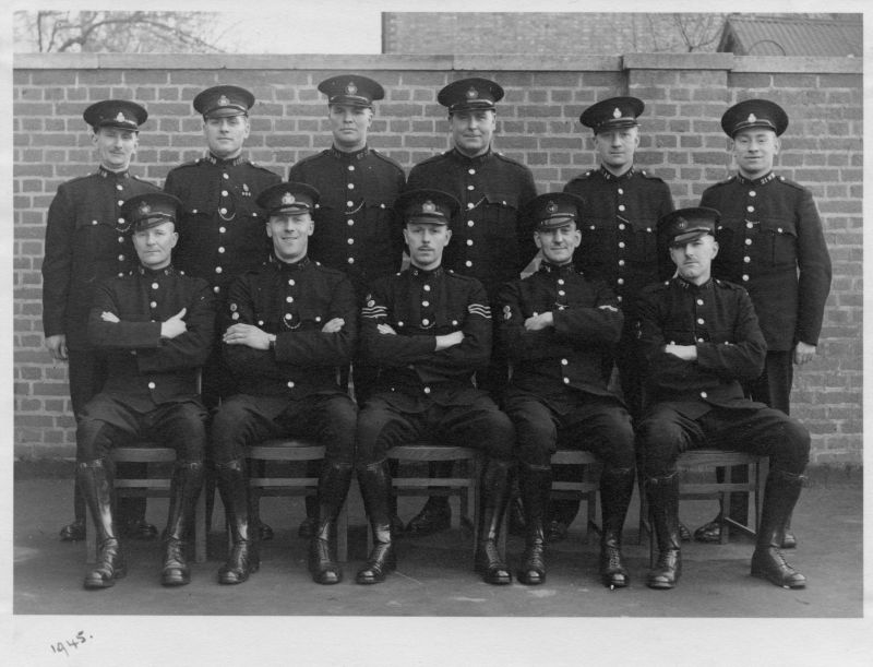 OXFORD CITY POLICE, DATED 1945
A group of police officers including 3 War Reserve officers.
The numbers are as follows:
Back Row (L-R) 58WR; 98OP; 66OP; 24OP; 14WR; 21WR
Front Row (L-R) 95OP; 76OP; Sgt 13OP; 74OP; 71OP
I think that Sgt 13OP may be the same person as Cst. 13OP submitted earlier.
