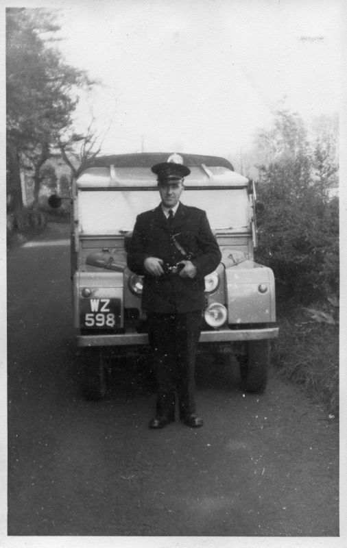 ROYAL IRISH CONSTABULARY
Officer is standing in front of an old Land Rover
