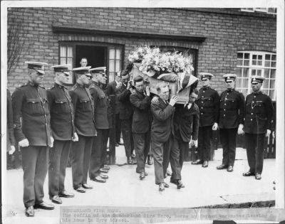 SUNDERLAND BOROUGH POLICE FUNERAL
Label on print reads:
Sunderland Fire Hero
The coffin of the Sunderland fire hero, bourne by former workmates leaving his home in Eyre Street.

Honour Guard P.C.'s numbers (L - R):
147: 54: 155: 30: 92: 48: 37.
