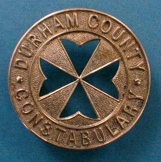 Durham County Constabulary St John Ambulance Badge
St John Ambulance Badge worn by officers on the left sleeve, Durham issued these between 1892 and the 1920's when they ceased to be issued.  Lug fitment on rear secured by a split pin.  The issue of these badges was discussed at a Standing Joint Committe held at Shire Hall, Durham on 6th August 1889 with the CC Lt Col George Francis White, and finally resolved on 17th January 1891 when it was decided to purchase and issue the badges.
Keywords: Durham County Constabulary badge
