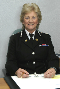 Barbara Wilding, CBE, QPM, CCMI, FRSA, Chief Constable South Wales Police 2004 - 2009
Miss Wilding joined the Jersey States Police as a cadet in 1967 and was attested as a constable in 1970.  In 1971, she transferred to the Metropolitan Police.  She became an Assistant Chief Constable in Kent Constabulary in 1994. 

In 1998, she transferred to the Metropolitan Police as Deputy Assistant Commissioner serving as Director of Strategic Resources and Specialist Operations.

Miss Wilding was appointed Chief Constable of South Wales Police on 1st January 2004 holding this position as the UK's longest serving female Chief Constable until her retirement on 31st December 2009.
          
Miss Wilding is a Co-Director for the Police National Assessment Centre for senior command.  She chairs the ACPO Acquisitive Crime Committee and is a member of the ACPO Terrorism and Allied Matters Committee.  She also oversees a National Mentoring Scheme for women Superintendents.

Miss Wilding read criminology at London University and is Honorary Fellow of Cardiff University. She was decorated with the Queen’s Police Medal for distinguished service to policing.  Miss Wilding was also awarded Commander of the British Empire medal for her services to policing.

Her term was characterised by Government funding issues and as the force's budget was reduced she took the controversial decision to cease patrols on the M4 Motorway to cut costs. Her decision was described by her as "In relation to the M4, as our finances get more and more reduced, there are things you have to say we have to stop doing, the things we are not mandated to do under legislation, and that was one of them."

Keywords: South Wales Chief Constable