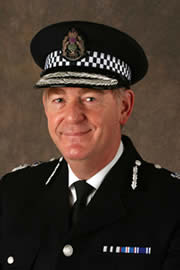 Andrew Cameron QPM CBE Chief Constable Central Scotland Police
Mr Cameron was appointed Chief Constable of Central Scotland Police on 1 August 2000. 

Born in 1953 Andrew Cameron served as a police cadet, later joining Ayrshire Constabulary 1972, and thereafter Strathclyde Police following regionalisation. He served in the operational, research, administrative and command areas in both uniform and CID duties.

From 1991 to 1994 he was a Staff Officer to HM Inspector of Constabulary, at the Scottish Office. He carried out inspections in respect of the 8 Scottish Forces. He also conducted inspection work in Namibia, for the Overseas Development Administation.

Returning to Strathclyde Police in 1994, he was Sub-Divisional Officer in the Clydebank & Drumchapel areas (formerly 'B' Division) until 1995, when he led a project team in undertaking a review of the CID. In September 1995 he became Deputy Divisional Commander and 1996 Divisional Commander of 'U' Division.

In October 1997, he and the former Assistant Chief Constable John Welsh, assisted Western Australia Police to review investigative and training practices and the strategies used to tackle crime throughout Western Australia.

After a term as Personnel Officer for Strathclyde Police, he became Assistant Chief Constable (Management Services) in April 1998. Here he was responsible for the restructuring of territorial police divisions. The restructuring of Force Headquarters departments also commenced at this time. On 1 April 1999 he became Assistant Chief Constable (Operations) he was responsible for strategic planning for all major events impacting upon Strathclyde Police, such as the Tall Ships Race, the England v Scotland Euro 2000 play-off in 1999, and preparations for the Millennium date change and celebrations.

Mr Cameron attended the University of Strathclyde, and in 1983 graduated with a BA in Business Administration. Awarded the Queen's Police Medal in 2002 he was made a Commander of the Order of the British Empire (CBE) in 2007.
Keywords: Andrew Cameron Chief Constable Central Scotland Police