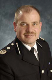 Craig Mackey Chief Constable Cumbria Constabulary
Craig Mackey joined the Police Service in 1984 having previously been in the Merchant Navy where he worked for BP Shipping and trained as a deck officer. His initial police service was spent in Wiltshire where he held a variety of operational roles and commands. In 1991 he was selected for the Accelerated Promotion Course at Bramshill.

In 1999 he was selected as a specialist staff officer for her Majesty’s Inspector of Constabulary based at the Home Office. In this role he completed specialist inspections and thematic inspections, including the thematic ‘policing disorder’. He was also involved with a small team redesigning inspection protocols for forces.

He attended the Strategic Command Course at Bramshills in 2001. Whilst on the course he spent some time working with the Chicago Police looking at their approach to the review of murder enquiries. In November 2001, he joined Gloucestershire Constabulary as Assistant Chief Constable, as ACC he led on the outsourcing of custody guards and the introduction of PCSOs to the Force. In an operational capacity, he was the Gold Commander for the terrorism operation in Gloucester that resulted in the arrest of the second shoe bomber, and led the policing of the Gold Cup and the Royal International Air Tattoo at Fairford.  In 2005 he was appointed as Deputy Chief Constable, and amongst other achievements led the project to relocate to a new PFI Headquarters.

For the Association of Police Officers (ACPO) he sits on the Race & Diversity Business Area and leads for the service on Stop & Search and the monitoring of police powers. He is currently chair of the North West Regional ACPO.

He is married with one child and enjoys mountain biking, reading and is a keen rugby fan.
Keywords: Craig Mackey Chief Constable Cumbria Constabulary